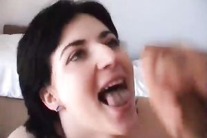 Short haired cute brunette hair with large wobblers receives it in her throat