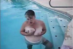 My elderly slutwife demonstrates her large love muffins in the pool