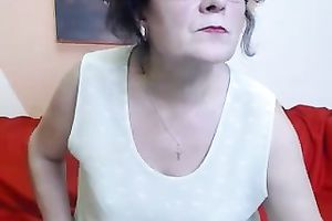 My old dirty slut wife undresses in front of a livecam and fingers her cookie