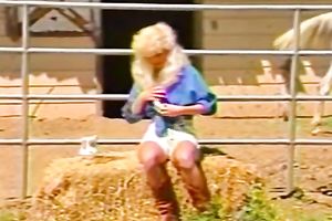 Big breasted dumpy blondie turbulently fingers her hirsute kitty outdoors