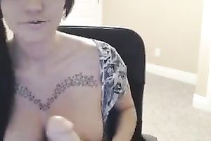 Busty webcam skank smashes her vagina with a large realistic sex toy