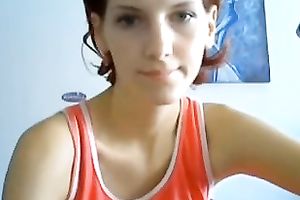 Webcam solo with a redhead beauty tickling her smooth pussy