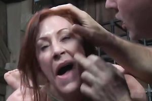 Redhead milf receives tied and tortured in a basement