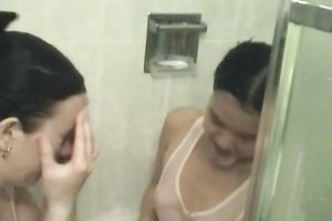 Asian honey and her bulky ally take a washroom jointly in lesbo vid