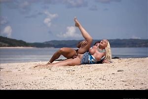 Lascivious and breasty golden-haired pecker rider on the beach