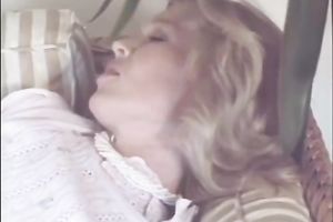 Blonde milf finger fucks a hirsute and wet vagina in bedroom