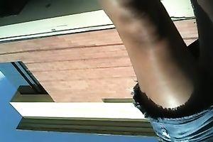 Another sexy mulatto playgirl gets caught on shoe camera in her short petticoat