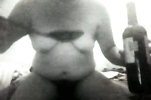 Fat wazoo doxy with saggy titties is rubbing her shaggy twat on webcam