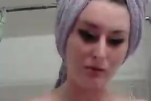Lubricious bitch acquires into a bathtub and begins masturbating