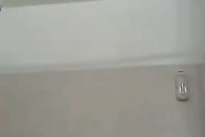 Lubricious bitch acquires into a bathtub and begins masturbating