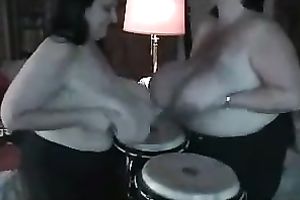 Chubby nymphos are playing drums with their large knockers