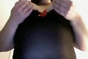Obese brunette hair wearing a see-through costume shows her billibongs and a-hole