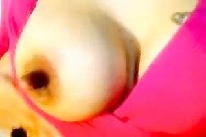 Brunette milf shows her large hard teat in webcam solo scene