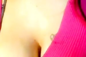 Brunette milf shows her large hard teat in webcam solo scene