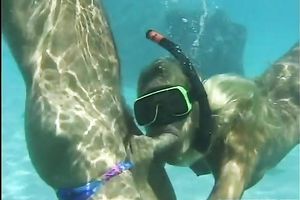 Blonde babe sucks a jock beneath water and receives drilled from behind