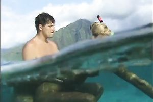 Blonde babe sucks a jock beneath water and receives drilled from behind