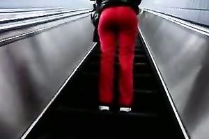 This slender playgirl on an escalator looks very tempting in taut red panties