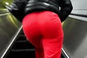 This slender playgirl on an escalator looks very tempting in taut red panties