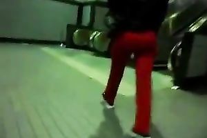 This slender playgirl on an escalator looks very tempting in taut red panties