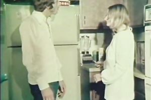 Cute playgirl in the kitchen receives on her knees to engulf a knob