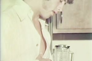 Cute playgirl in the kitchen receives on her knees to engulf a knob