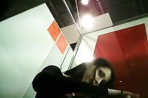 Slim dark brown cutie stripping in front of a hidden livecam