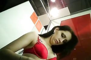 Slim dark brown cutie stripping in front of a hidden livecam