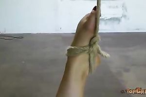 Heart stopping raven haired dark brown babe is bounded by breathtaking domme