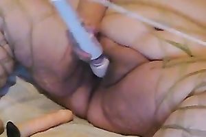 Super obese harlot in glasses tickles her greasy vagina with her Hitachi