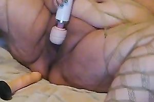 Super obese harlot in glasses tickles her greasy vagina with her Hitachi