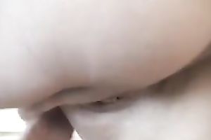 Alluring dark brown wife plays with her fur pie in the kitchen