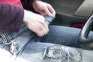 Brunette skank pees in her jeans at a busstop and enjoys herself