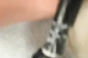 My nasty black cock sluts entertains herself by fucking her snatch with a toy