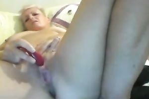 Webcam solo movie with a aged golden-haired toying her cookie