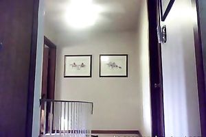 Horny slender white chick gets undressed on camera in the corridor