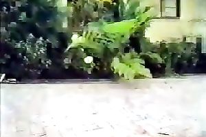 Lewd blond sucks a dark schlong outdoors and receives drilled in retro episode