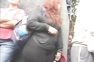 Huge-assed redhead slutwife acquires caught on a hidden livecam in the streeet