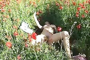 Pretty dark brown chick rubs her greatly shaggy cunt in the field