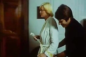 Retro blond housewife receives her boobs massaged by her maid
