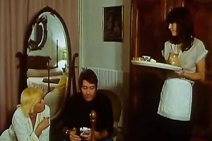 Retro blond housewife receives her boobs massaged by her maid