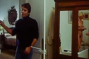 Retro blond housewife receives her boobs massaged by her maid