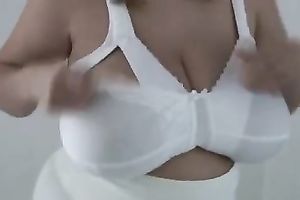 Huge-breasted masked mom plays with her whoppers in homemade solo