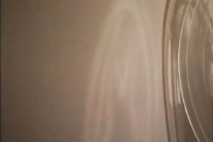 Retro dark brown disrobes and allows a fellow to play with her large bazookas