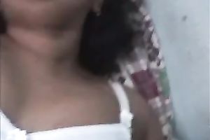 Curly haired Indian skank is showing off her natural tits