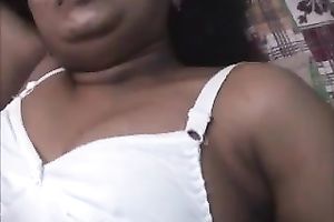 Curly haired Indian skank is showing off her natural tits
