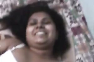 Curly haired Indian skank is showing off her natural tits