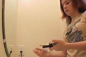 Redhead legal age teenager playgirl in the bath putting her makeup on