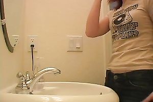 Redhead legal age teenager playgirl in the bath putting her makeup on