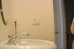 Redhead legal age teenager playgirl in the bath putting her makeup on