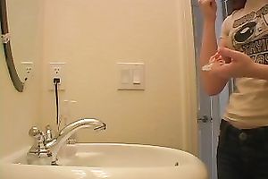 Redhead legal age teenager playgirl in the bath putting her makeup on